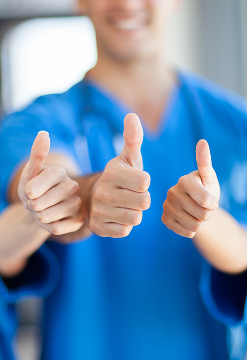 Three Waterford pediatric dental team members giving thumbs up